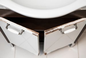 water damaged wood swollen furniture