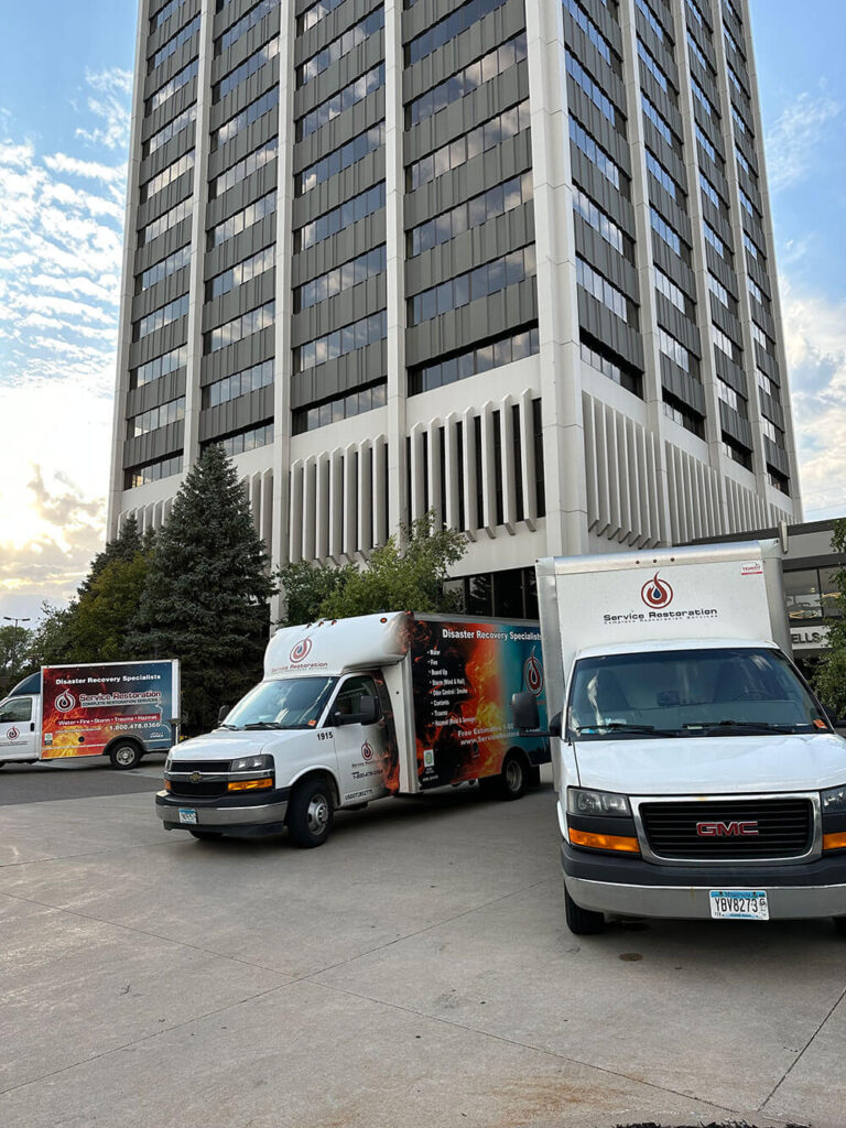 company trucks in front of commercial office building