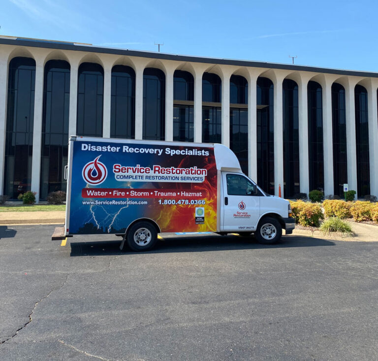 service restoration truck in front of commercial building