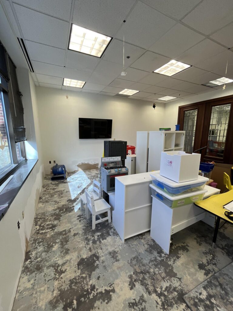 Water-damaged classroom in Apple Valley, MN during restoration and drying process.
